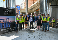Davis and TOCCI celebrate topping off of eight-story <br> 102-unit building 